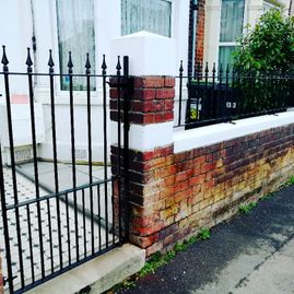 iron fence on wall and gate