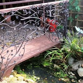 wrought iron panel on foot bridge